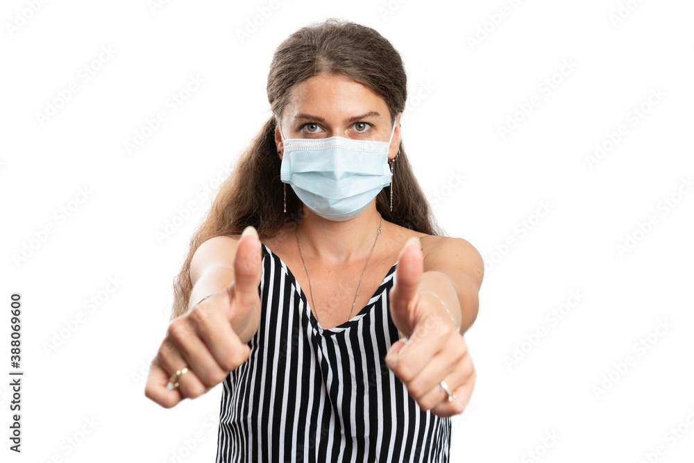 Female wearing covid protection mask showing double like gesture Female wearing covid protection mask showing double like gesture