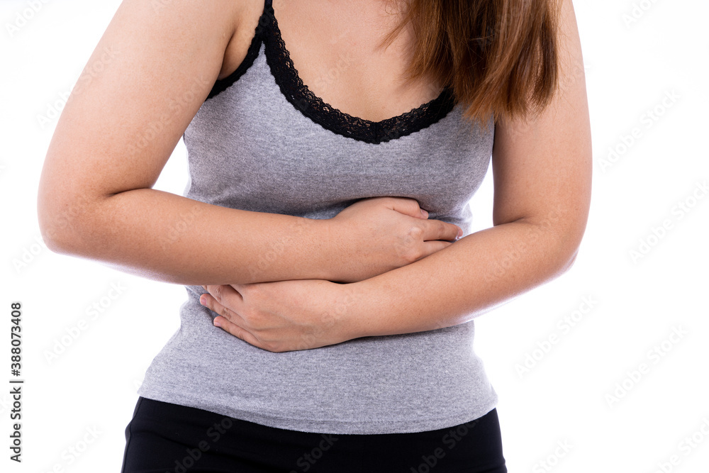 Woman suffering from stomach pain and injury isolated white background. Health care and medical concept. Woman suffering from stomach pain and injury isolated white background. Health care and medical concept.