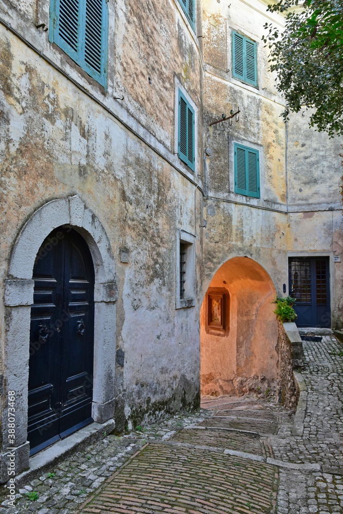 A narrow street among the old stone houses of Castro dei Volsci, a medieval village in the province of Frosinone in Italy.