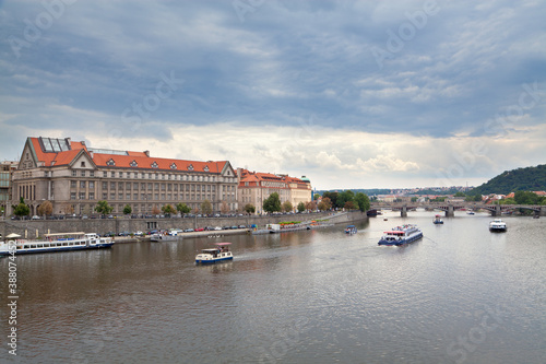 View of the river Vltava with cruising launches from the Čechův Bridge in Prague, Czech Republic.