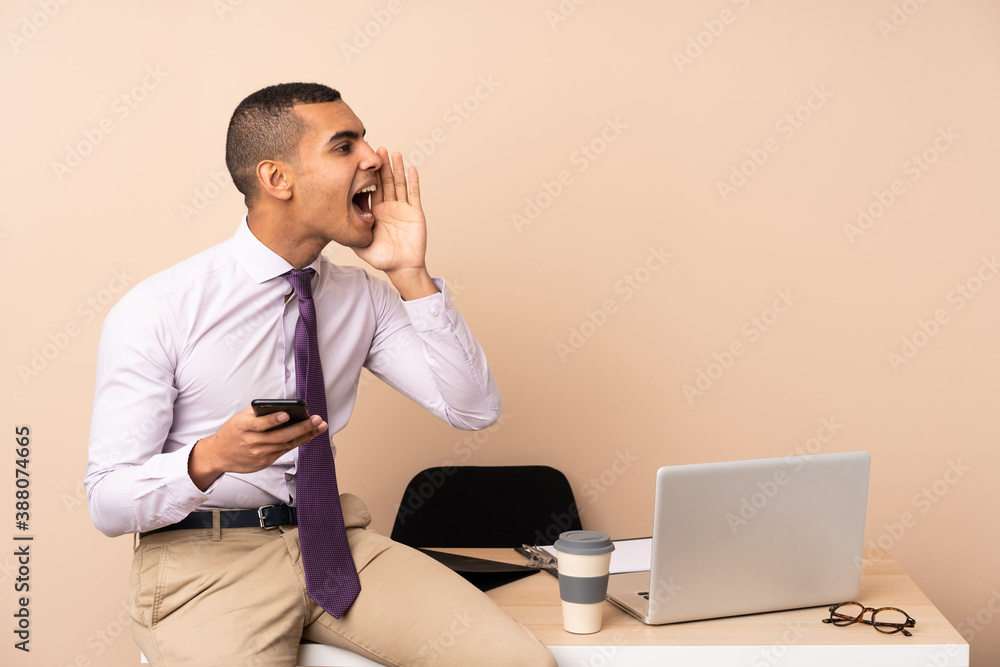 Young business man in a office shouting with mouth wide open Young business man in a office shouting with mouth wide open