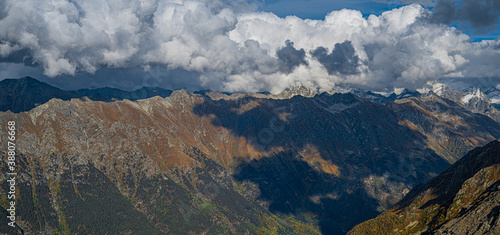 Fluffy clouds and high mountains © Mikhail