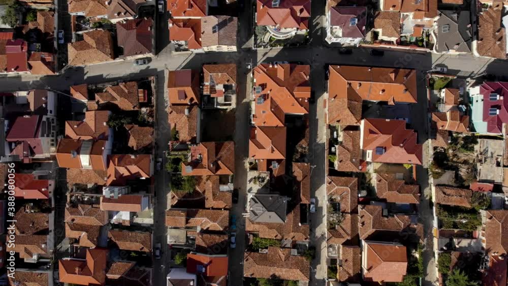 Silent alleys with red roof houses in beautiful city of Korca in Albania, top down view Silent alleys with red roof houses in beautiful city of Korca in Albania, top down view