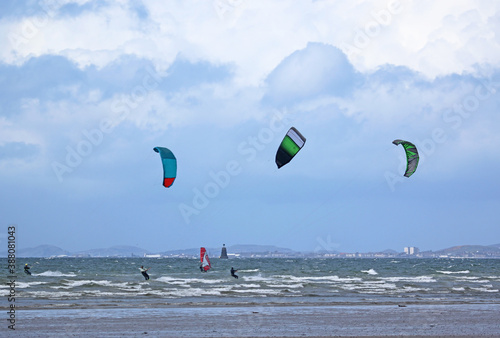 kitesurfers and windsurfers riding at Troon, Scotland	