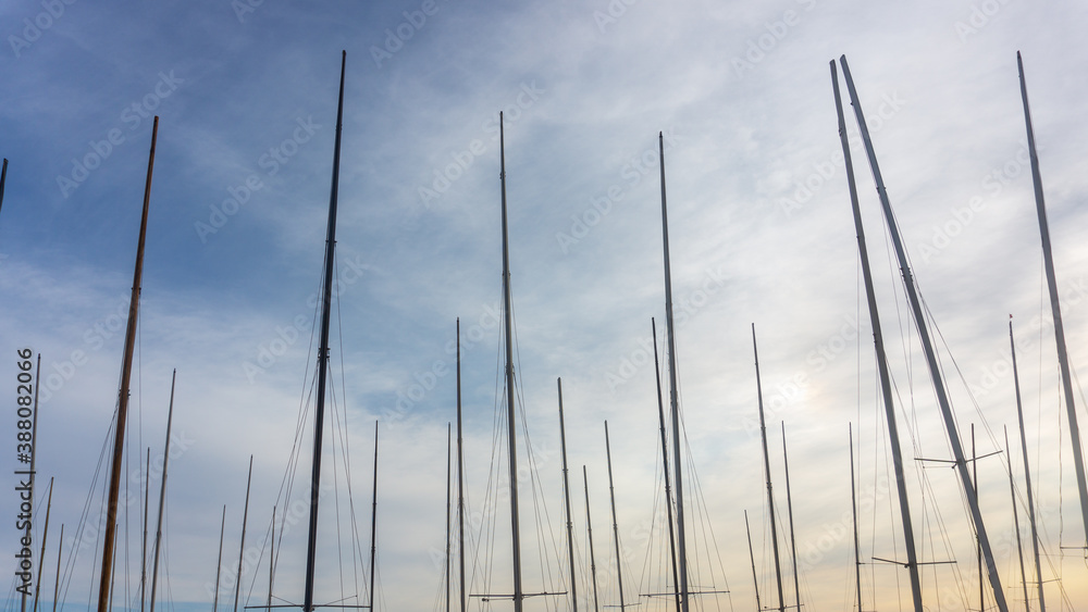masts of a boat in the blue sky