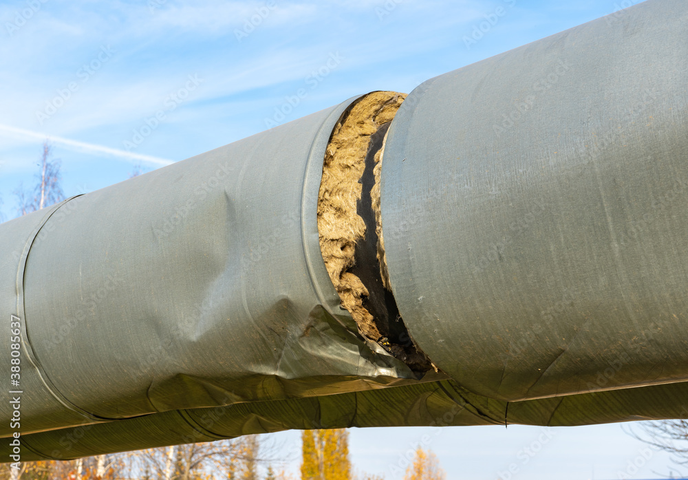 Damaged Central heating pipe. Break in the insulation of the heating main  Stock Photo | Adobe Stock