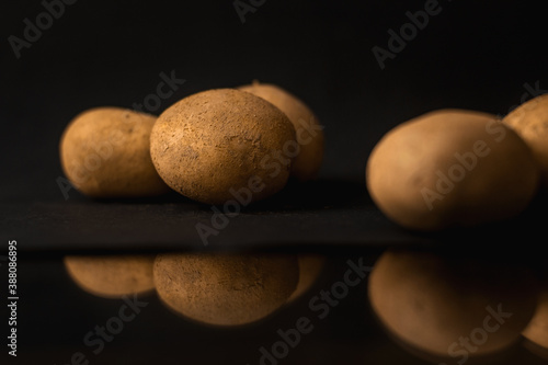 Potatoes on black background