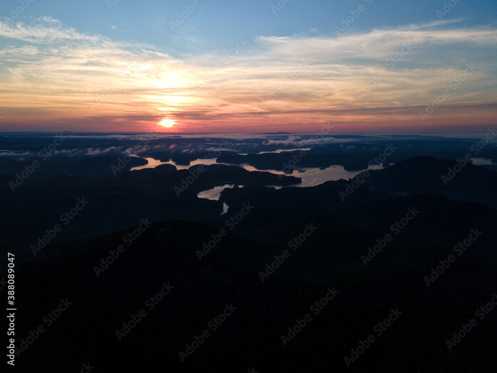 Fototapeta premium Sunrise over a lake in the mountains