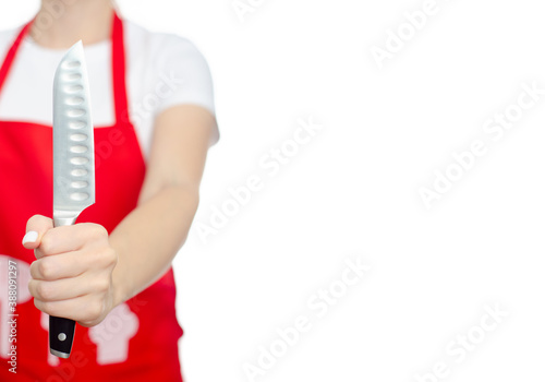 Woman in red apron holding kitchen knife cook on white background isolation