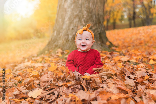 happy playful child girl outdoors in autumn season
