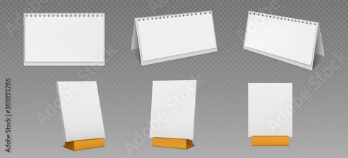 Desktop calendars with spiral and blank pages on wooden display stand isolated on transparent background. Vector realistic mockup of white paper calender, office planner or notepad standing on table