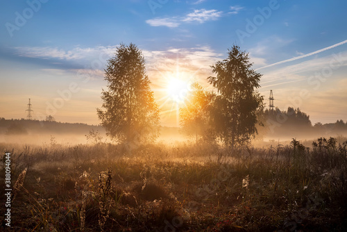 Mystic foggy landscape in the sunny morning in Russia.
