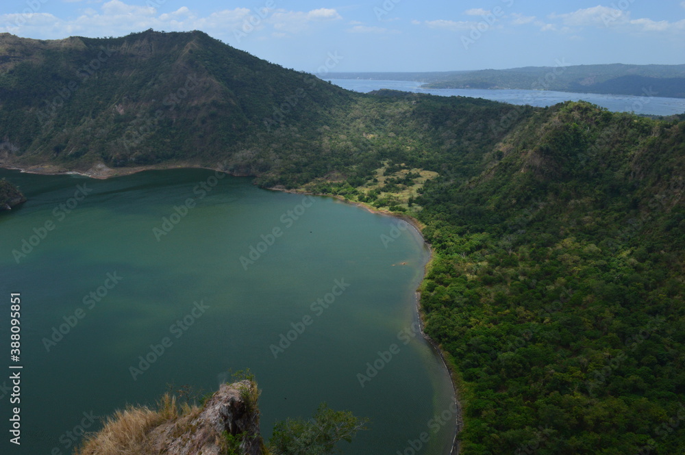 Obraz premium Hiking on the Taal Volcano island and on the Chocolate Hills of Bohol in the Philippines