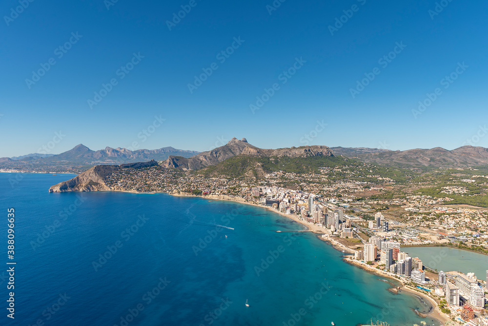 Coastal landscape with buildings on the seashore, Calpe city, Alicante, with tall buildings