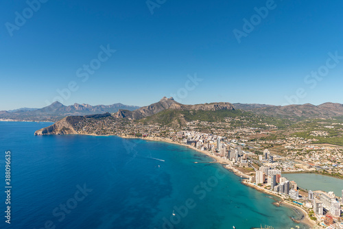 Fototapeta Naklejka Na Ścianę i Meble -  Coastal landscape with buildings on the seashore, Calpe city, Alicante, with tall buildings