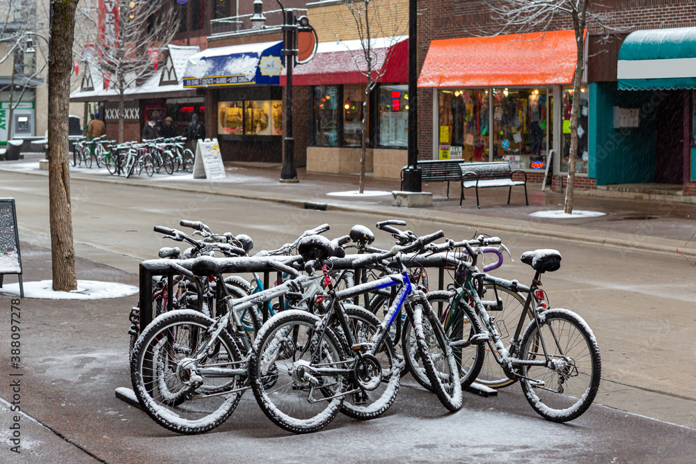 snow on group of bicycles 