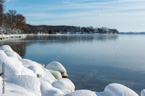 Fototapeta Naklejka Na Ścianę i Meble -  snowy rocks andfrozen lake in winter