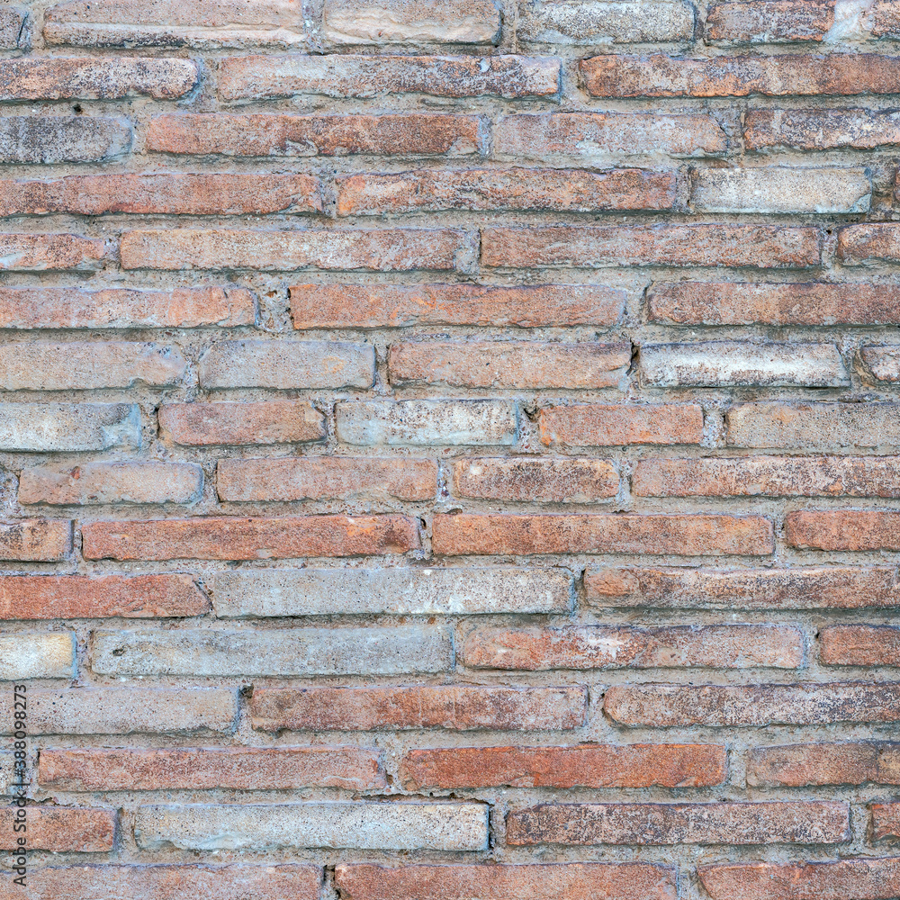 Obraz premium old brick wall of bricks of different sizes as background