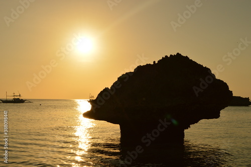 Sunset over the stunning beaches of the island of Boracay and hiking at the Taal Volcano lake in the Philippines photo