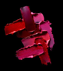 Set of lipstick strokes isolated on black background