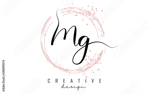 Handwritten MG M G letter logo with sparkling circles with pink glitter.