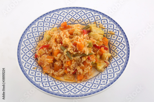 rice with paprika carrots and vegetables as vegan food