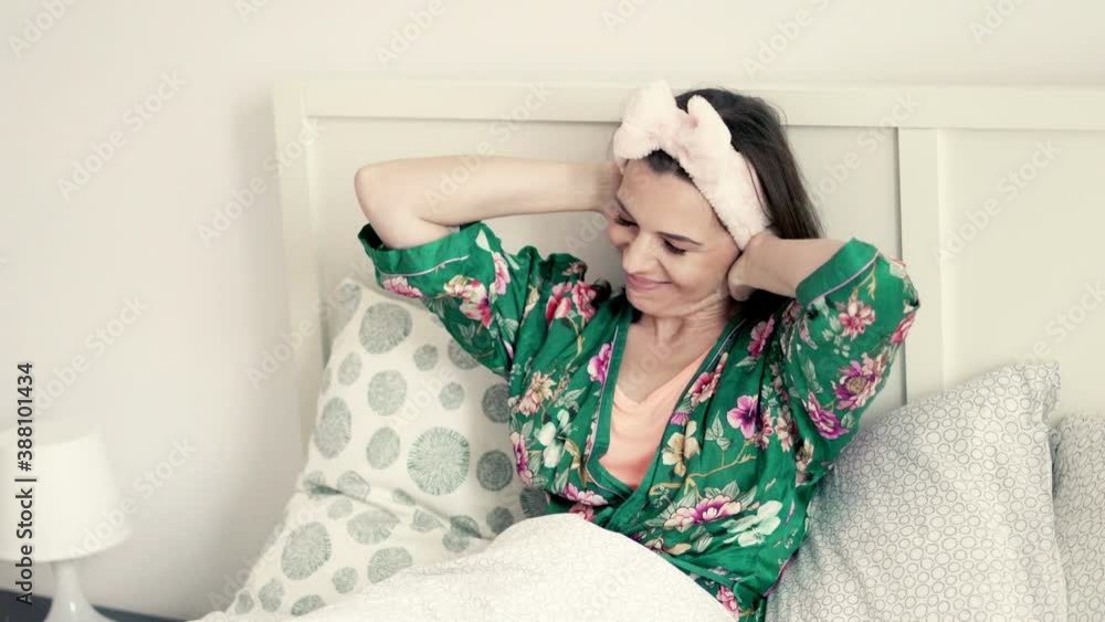 Young, beautiful woman waking up and stretching arms in bed, 4K
Young, beautiful woman waking up and stretching arms in bed, 4K