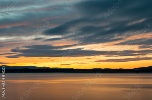 sunset blur reflection colorful sky clouds landscape © Tomasz