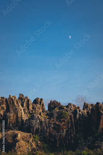 Moon over the mountains at daytime. Cerro del Hierro.