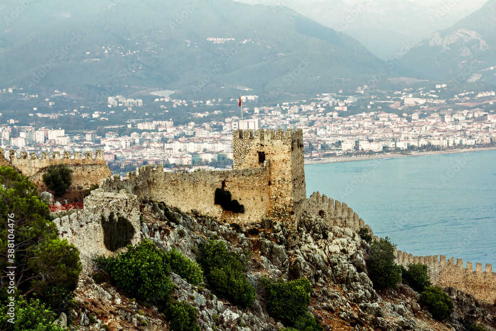 View of the walls of the ancient fortress and the harbor  in Alanya in Turkey