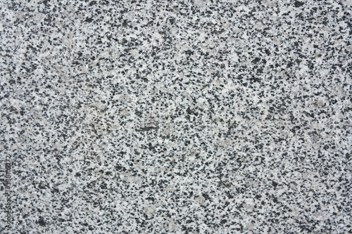 Textured abstract background in gray granite color.
