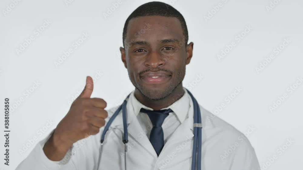 Thumbs Up by African Doctor, White Background Thumbs Up by African Doctor, White Background