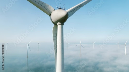 Wind turbines in sea covered with clouds,  Netherlands photo