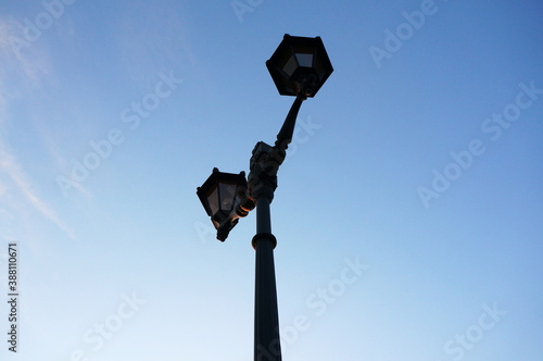 Photo of a lamppost on a blue sky background. Photo in jpeg format.