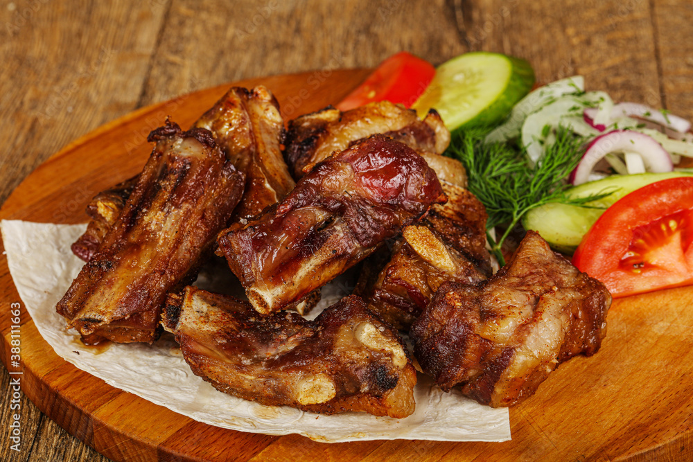 Grilled pork ribs barbeque with vegetables