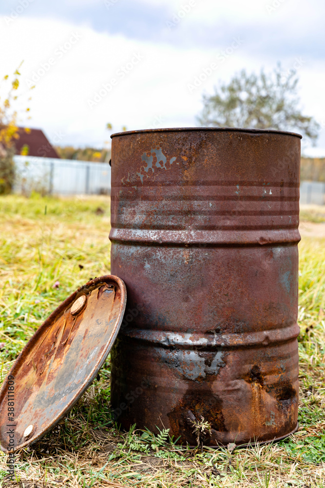 Rusty, iron barrel in the fields Rusty, iron barrel in the fields