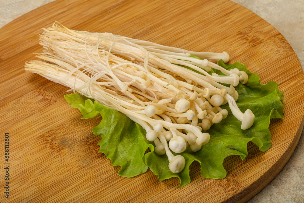 Raw Enoki mushrooms for cooking