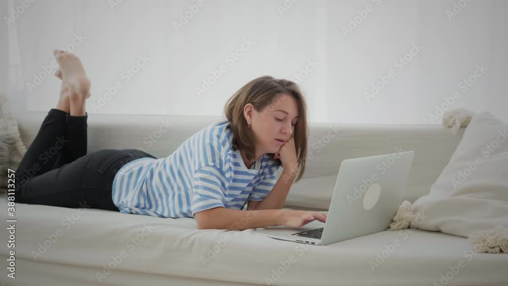 Female Freelancer Works With Her Laptop At Home Female Freelancer Works With Her Laptop At Home
