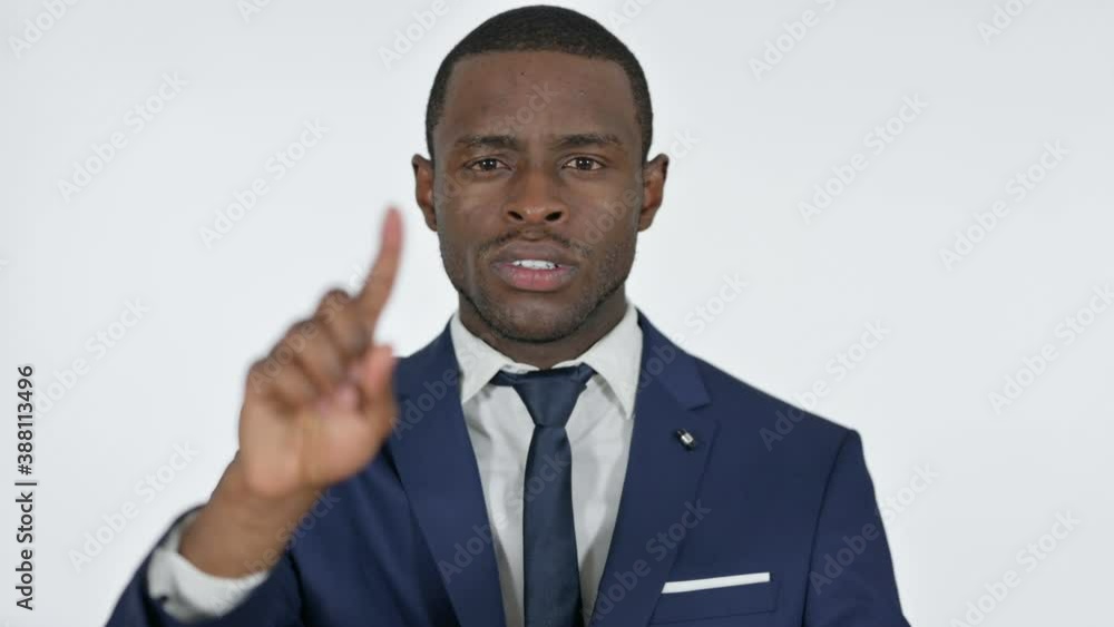 No Sign with Finger by African Businessman, White Background No Sign with Finger by African Businessman, White Background