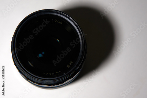 Photo of the lens on a white background with a falling shadow. Photo in jpeg format.