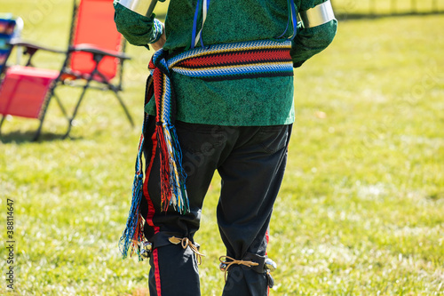 Obraz na plátne Selective focus of waist of unrecognized performer standing in colorful clothing