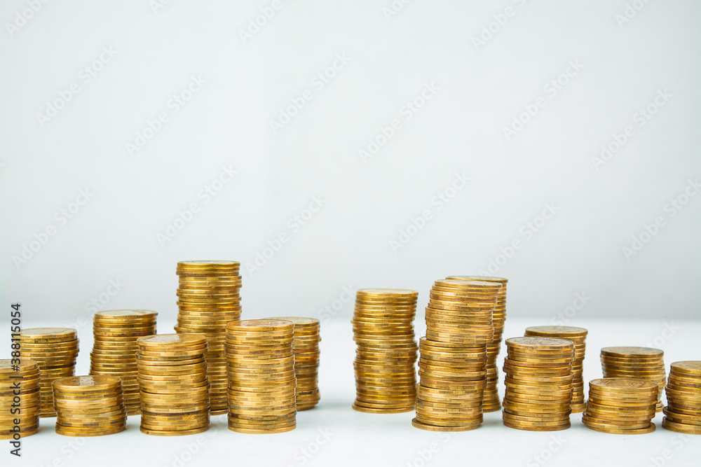Business concept. Columns of coins on a light table. Business ideas, business success. Business recovery and growth. Copy space. Business concept. Columns of coins on a light table. Business ideas, business success. Business recovery and growth. Copy space.