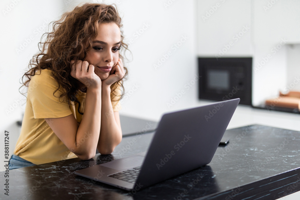 brunette woman watch movie on laptop at home brunette woman watch movie on laptop at home