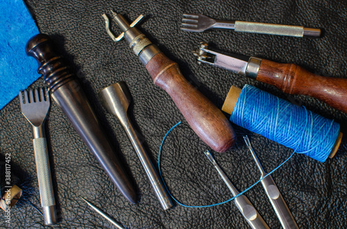 Genuine Leather. Sewing a purse. Leather work. Tools for sewing bags, wallets, clutches. Stitching. Manual sewing of the product. The manufacture of leather products.