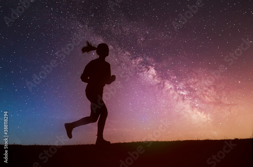 Silhouette of the running girl at night