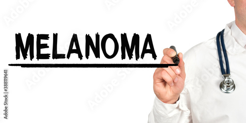 Doctor writes the word - MELANOMA. Image of a hand holding a marker isolated on a white background.