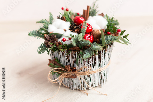 Christmas decoration with carnations, chrysanthemums santini, brunia and fir. photo