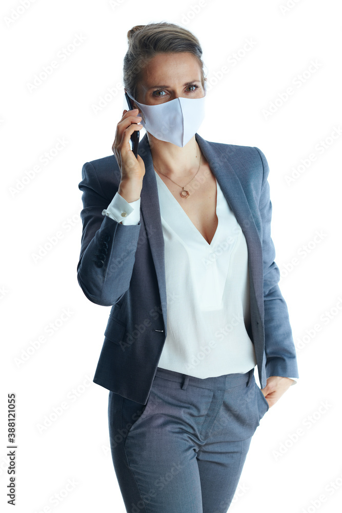 40 years old business woman in grey suit on using smartphone 40 years old business woman in grey suit on using smartphone