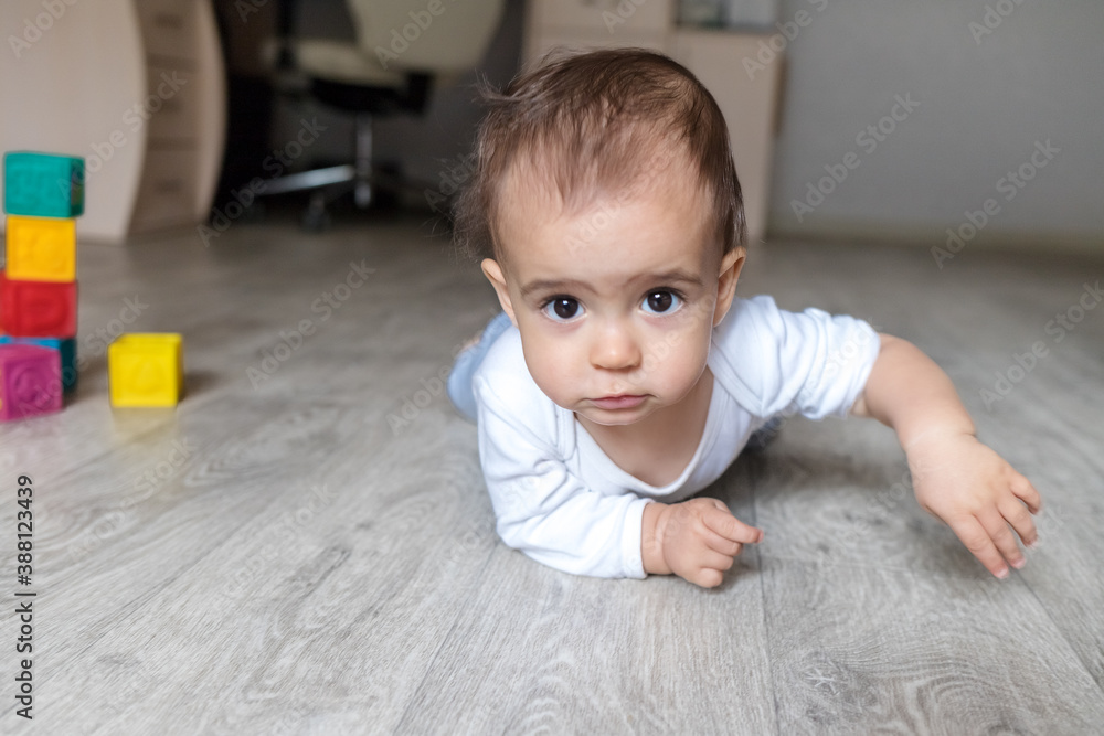 A little baby boy in white bodysuit at home . Beautiful portrait of a toddler. Big-eyed baby. Remote education. Distance learninig
A little baby boy in white bodysuit at home . Beautiful portrait of a toddler. Big-eyed baby. Remote education. Distance learninig