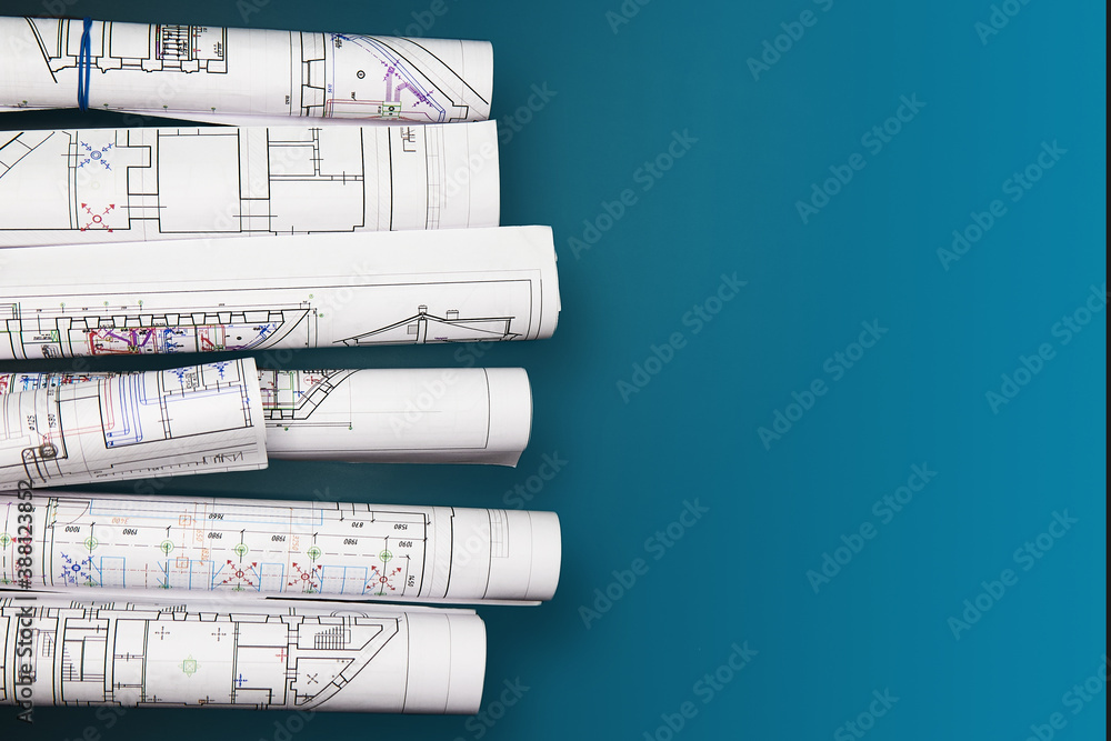 Architectural project, drawings on a dark background. Rolls of project drawings - obrazy, fototapety, plakaty 